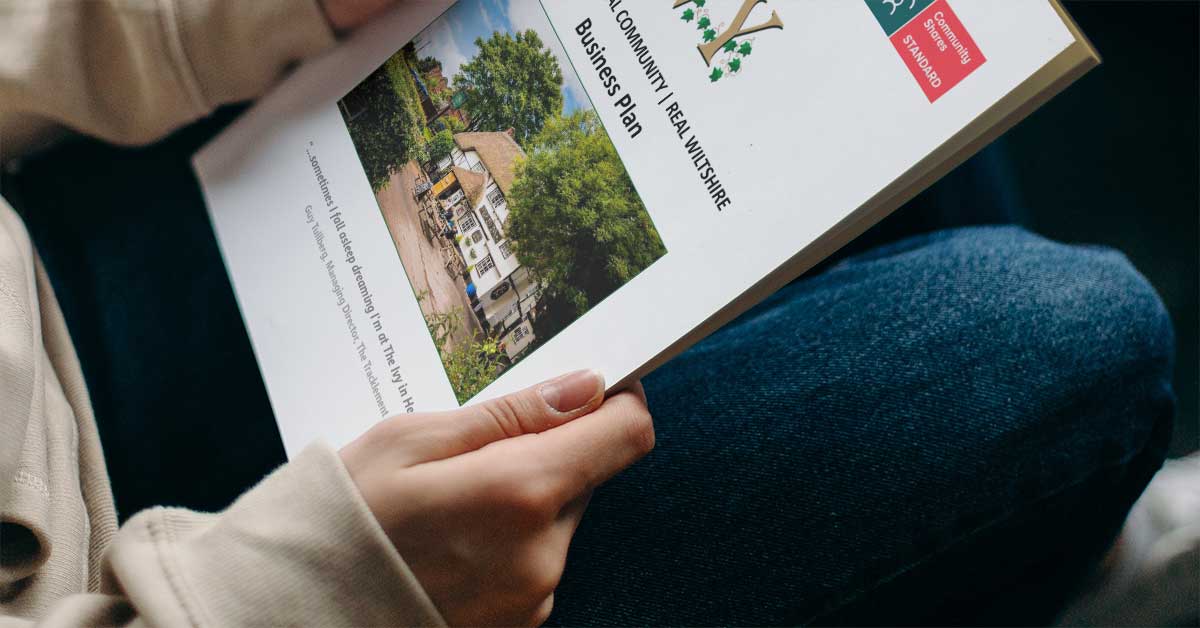 man reading Friends of The Ivy business plan